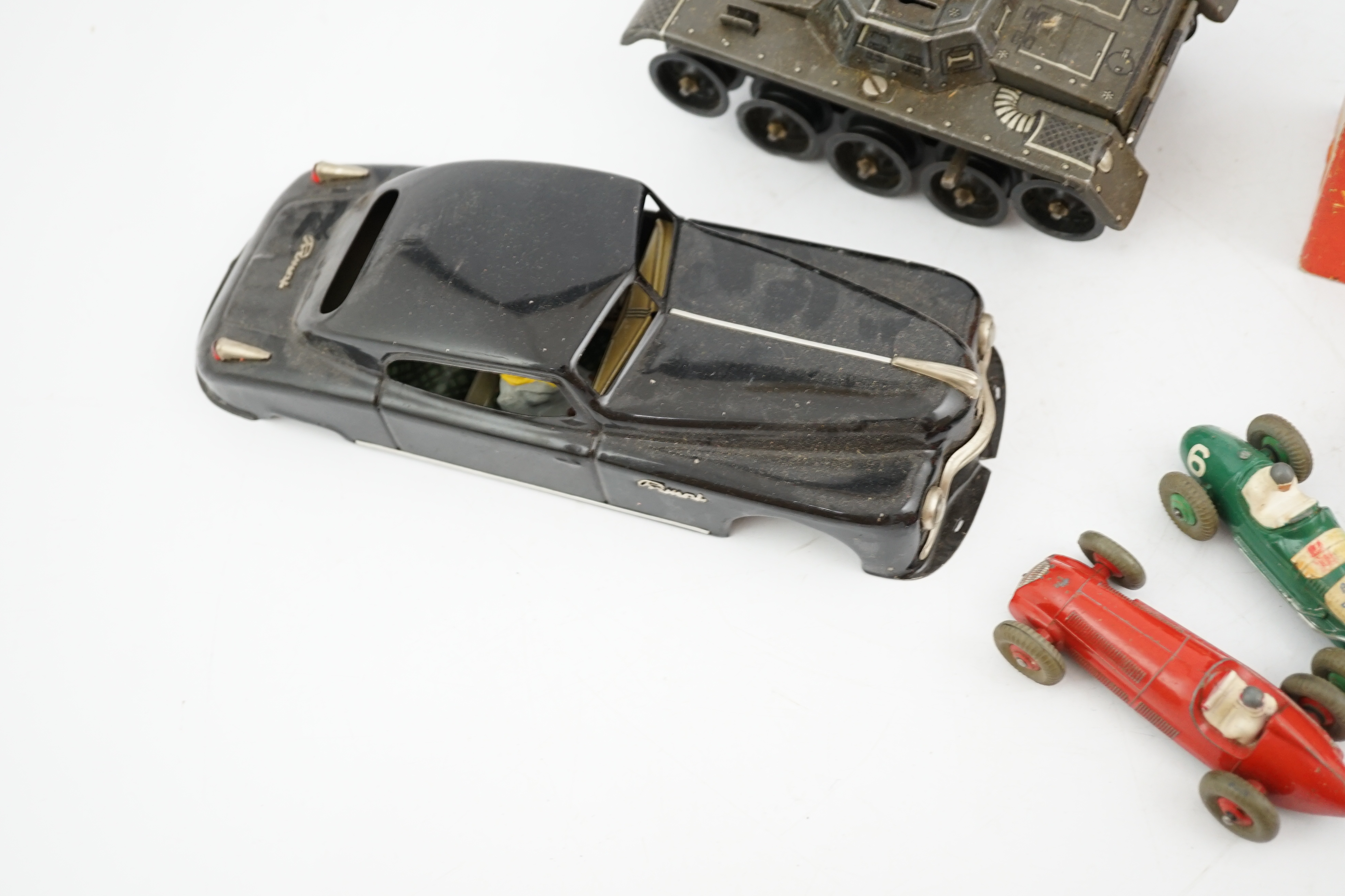 Eleven tinplate and diecast vehicles by Dinky Toys, Tri-ang, Gama, etc., including a Primal Arnold tinplate remote controlled car, a Tri-ang Minic Sports car with four speeds, a Gama Montage Tank, a Tri-ang Minic Armoure